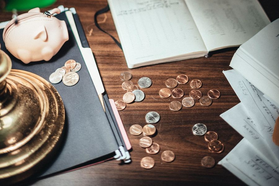 Notes and coins scattered on a table