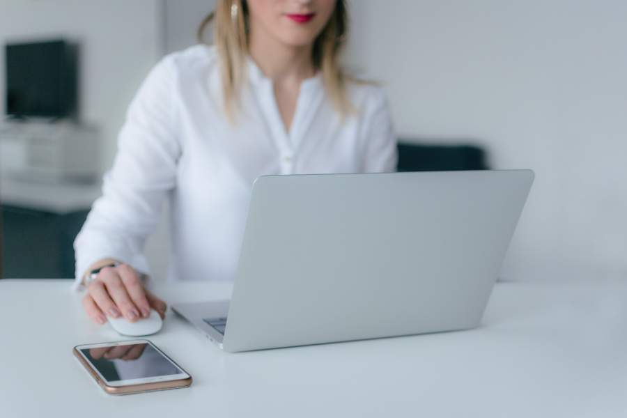 Woman using a laptop to look for real estate listings