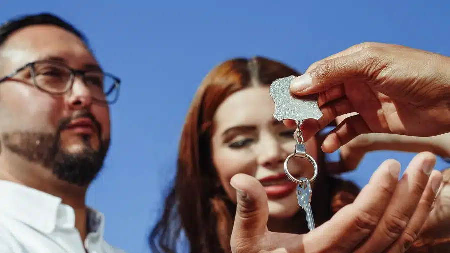 Handing giving keys to home buyers