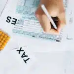 A person filling out a tax form