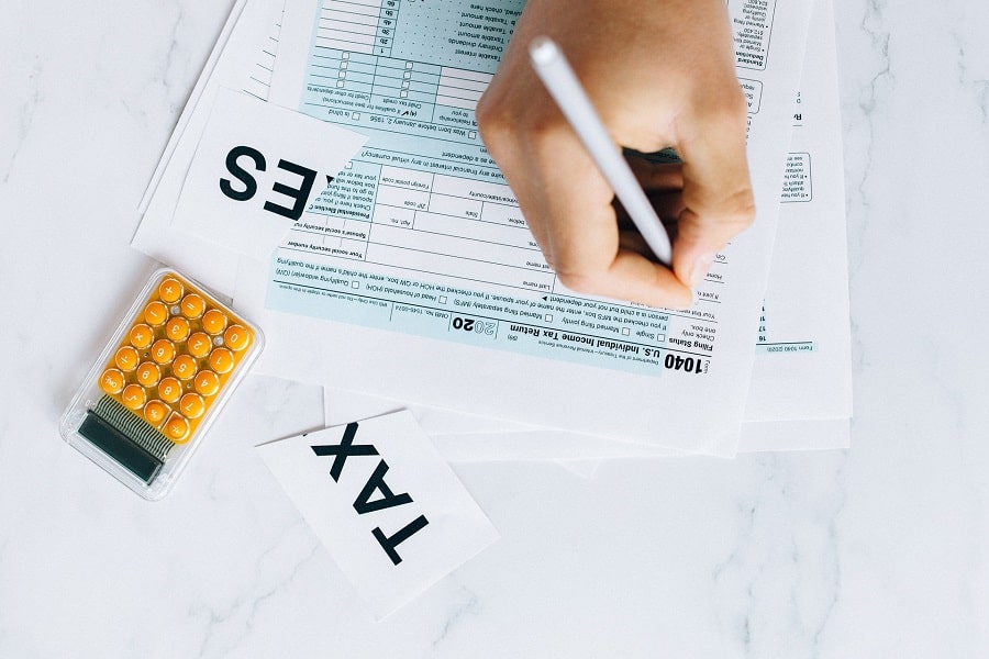 A person filling out a tax form