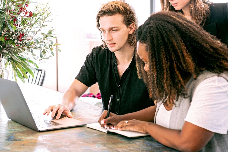 A man and a woman calculating real estate fees