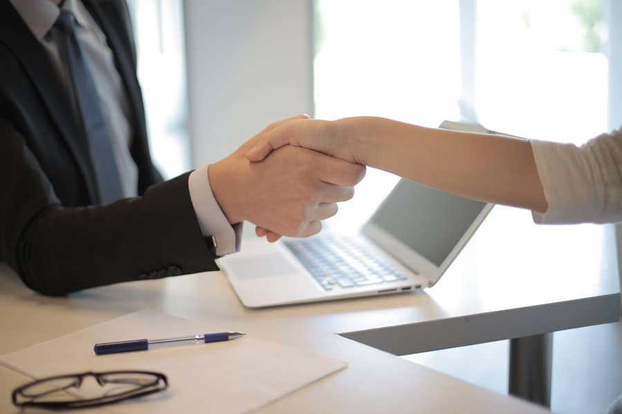 Realtor and client shaking hands