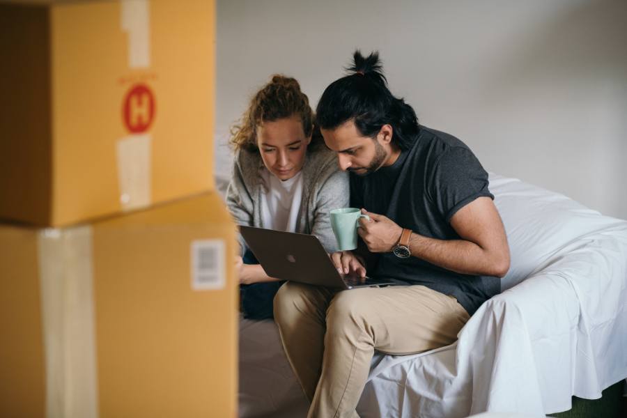 A man and woman selling their home through Redfin