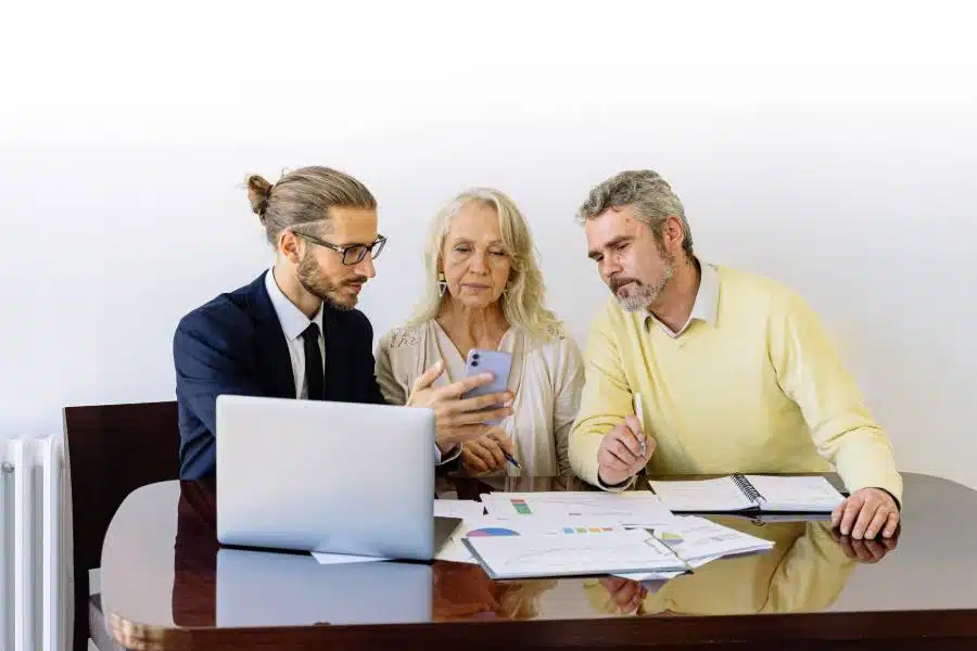 An old couple meeting with a real estate agent