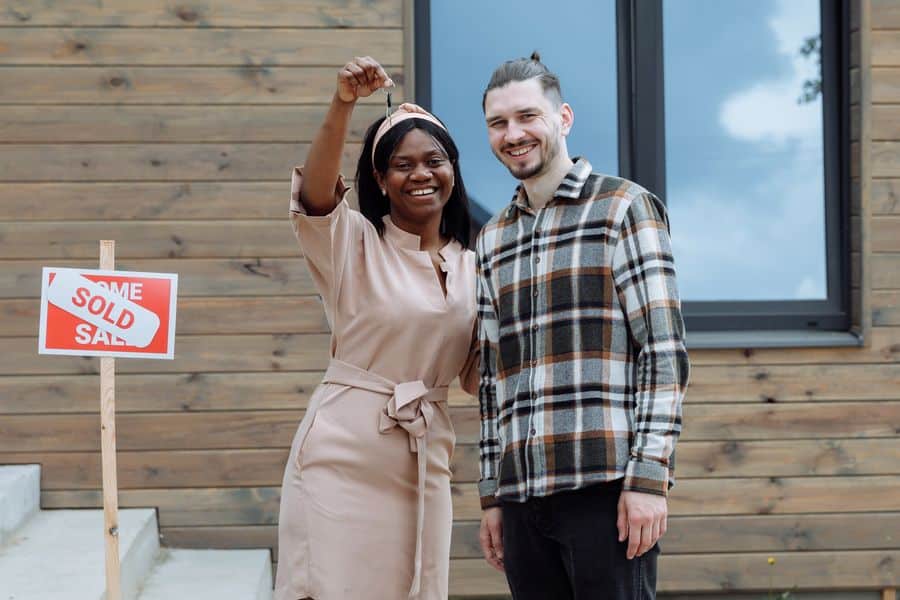 Couple showing off their new house keys