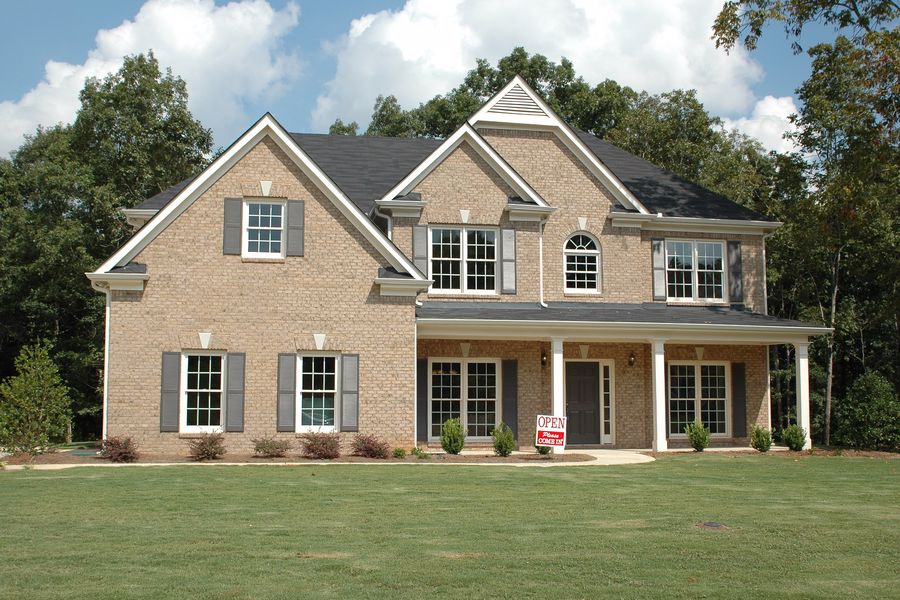 House with a for sale sign