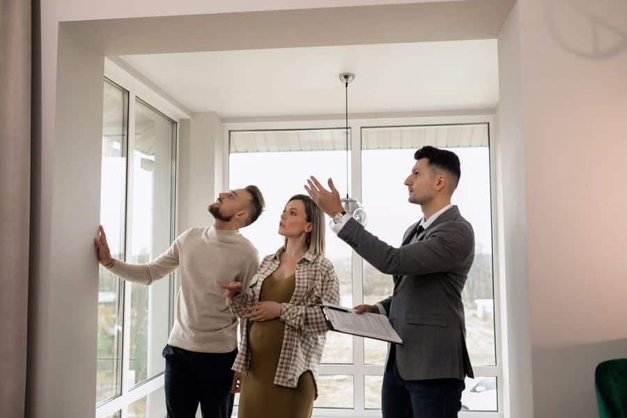 Realtor showing off the house to prospective buyers