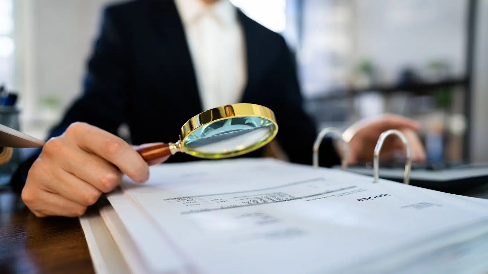 taxman inspecting property sell documents with a magnifying glass.