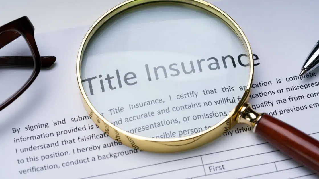 magnifying glass over a title insurance deed
